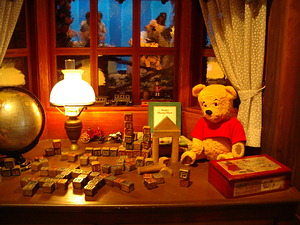 Detail of nursery area at conclusion of Pooh's Hunny Hunt -- you can see people getting off the ride through the window.